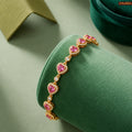 Zavera Gold Plated Pink Heart American Diamond Bracelet for Women