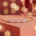 Zavera Gold Plated Dazzling Oval Cut American Diamond Bracelet for Women