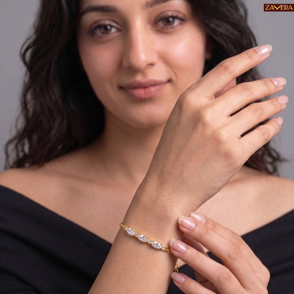 Zavera Gold Plated Dazzling Oval Cut American Diamond Bracelet for Women
