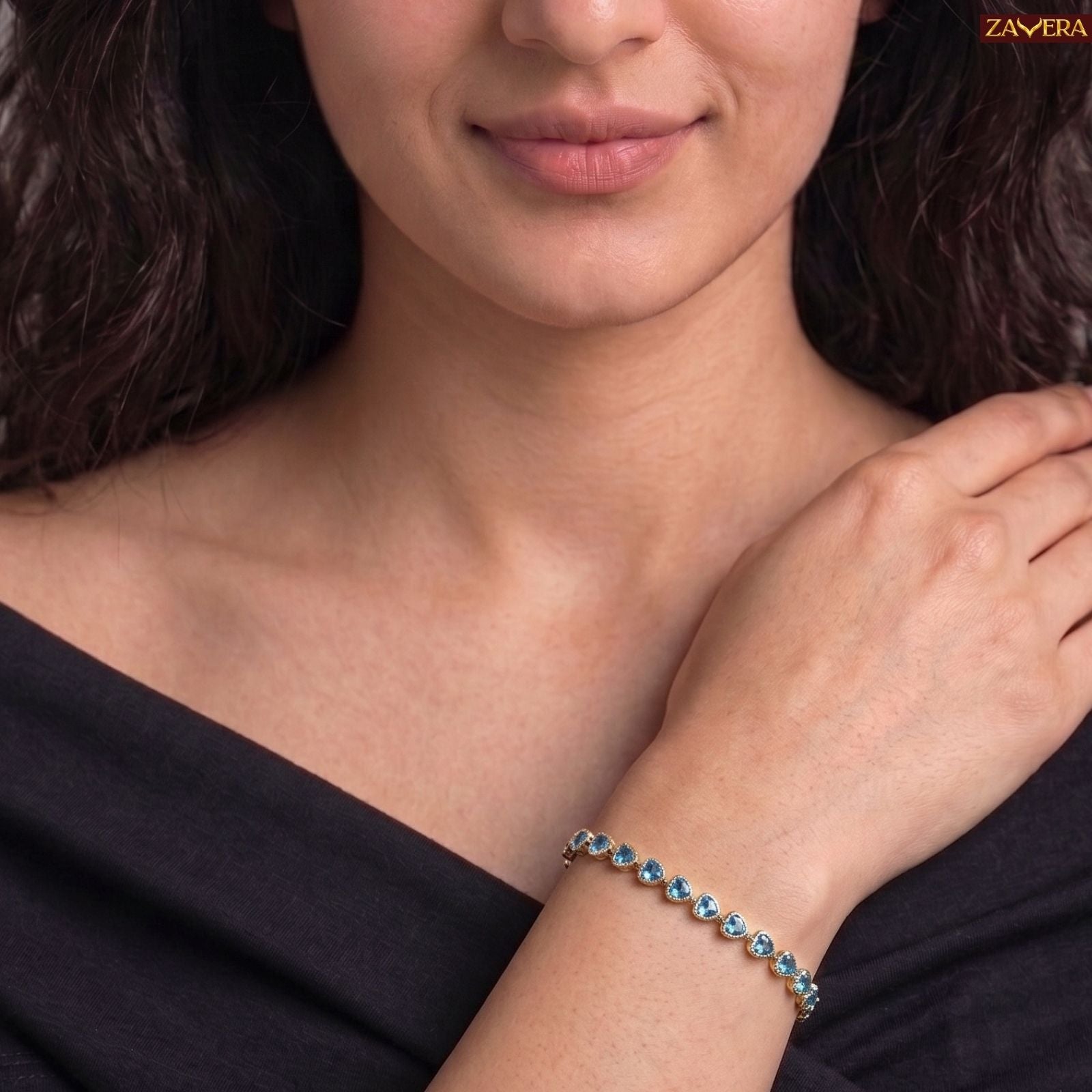 Zavera Gold Plated Blue Heart American Diamond Bracelet for Women