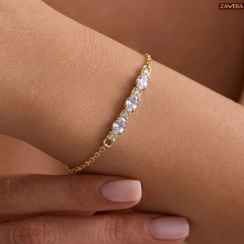 Zavera Gold Plated Dazzling Oval Cut American Diamond Bracelet for Women