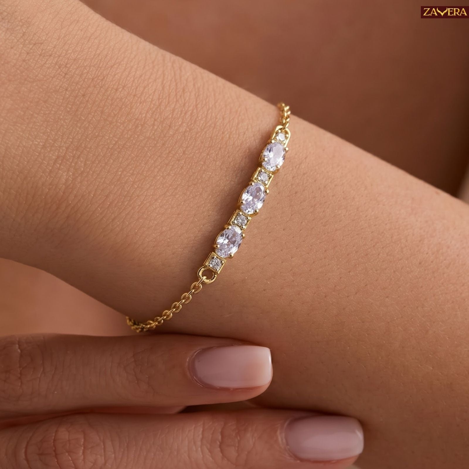 Zavera Gold Plated Dazzling Oval Cut American Diamond Bracelet for Women