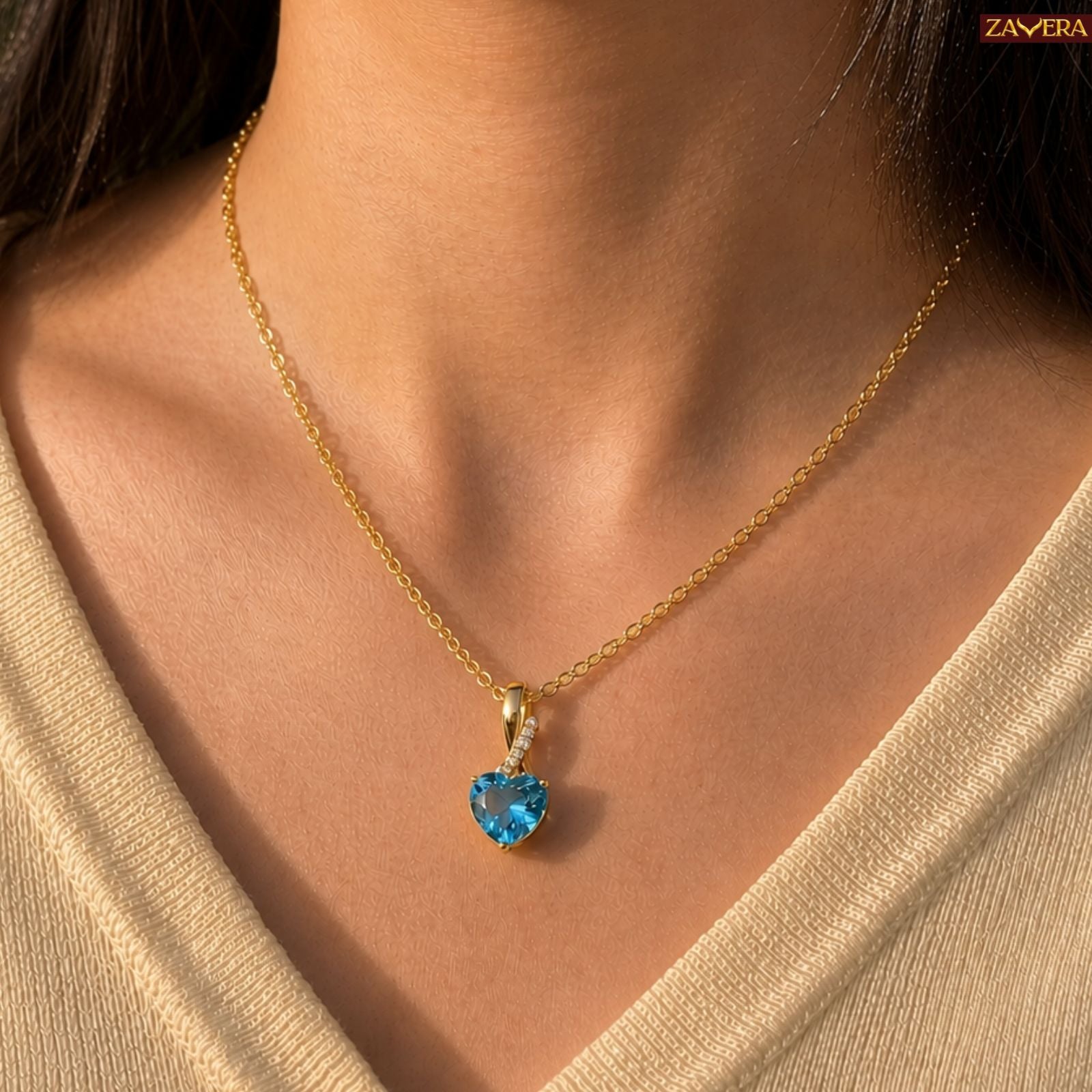 Zavera Gold Plated Blue Crystal Heart Pendant For Women