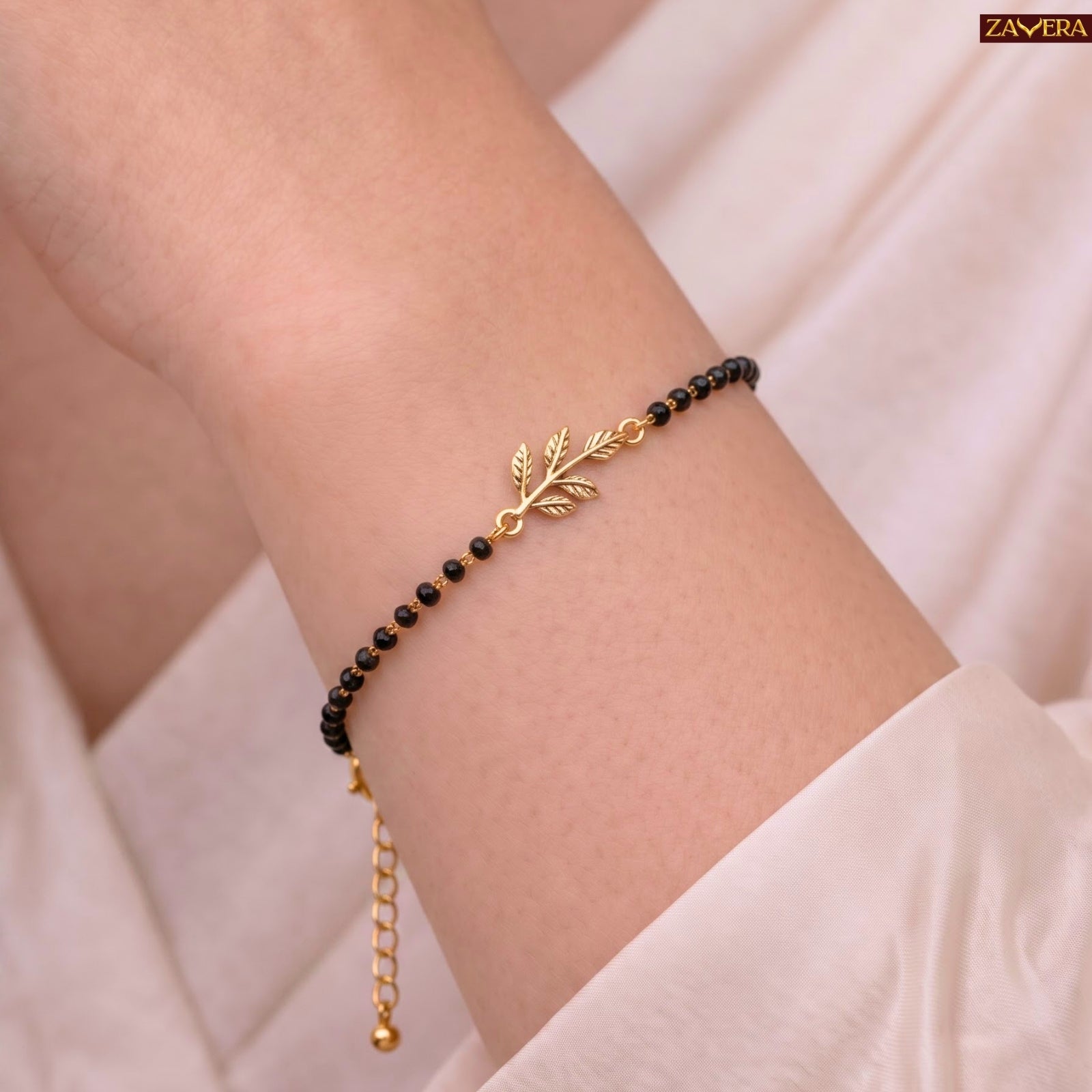 Zavera Gold Plated Black Bead Leaf Charm Bracelet for Women