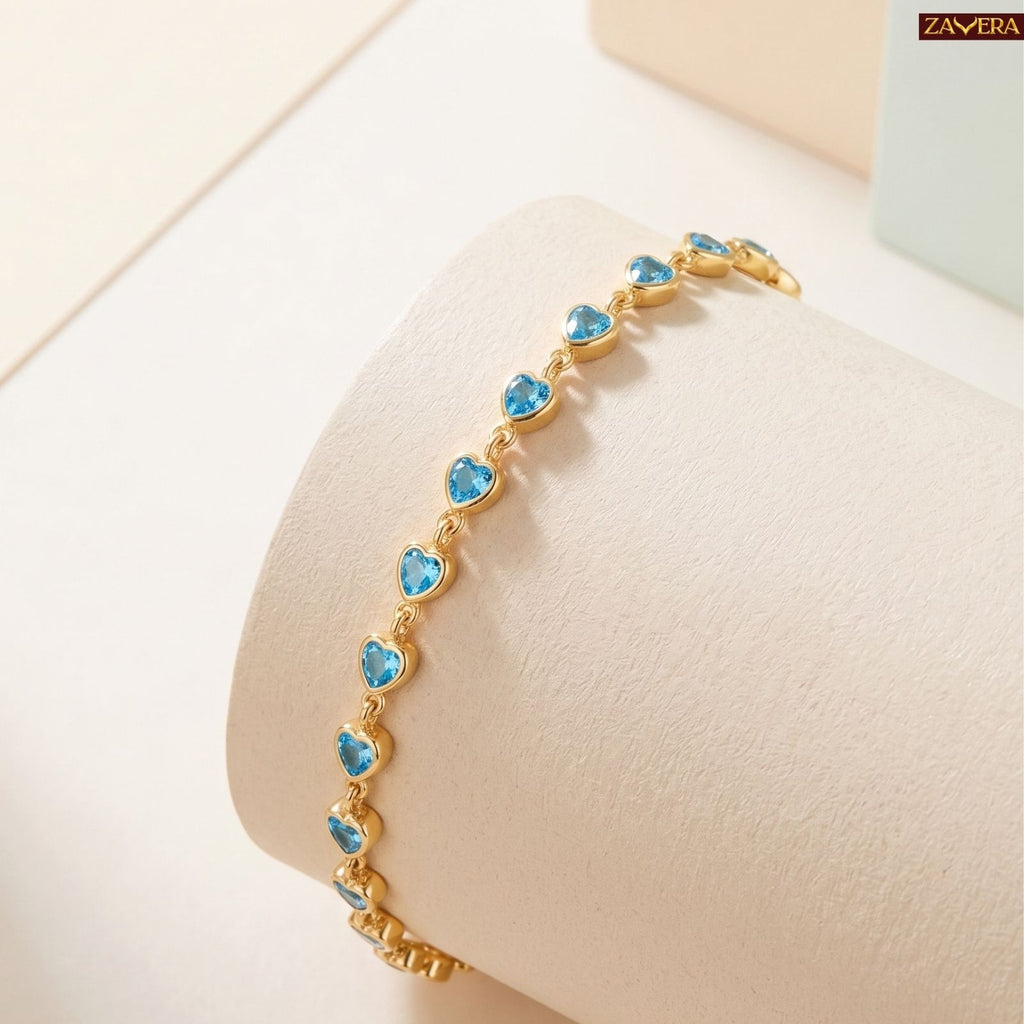 Zavera Gold Plated Blue Heart American Diamond Bracelet for Women