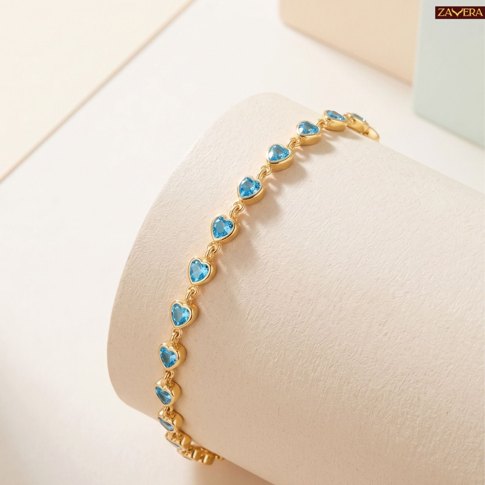 Zavera Gold Plated Blue Heart American Diamond Bracelet for Women