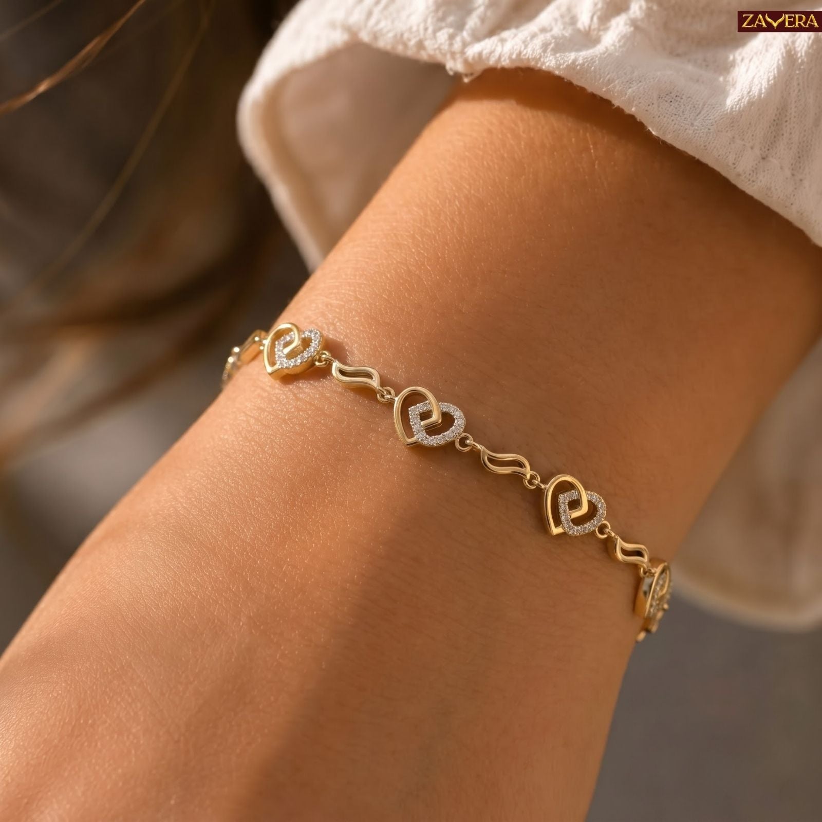 Zavera Gold Plated Interlocking Twin Heart CZ Crystal Charm Bracelet for Women